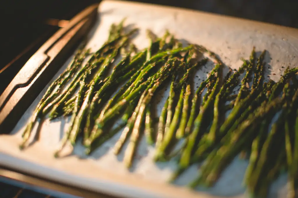 Cooking asparagus spears in a toaster oven.