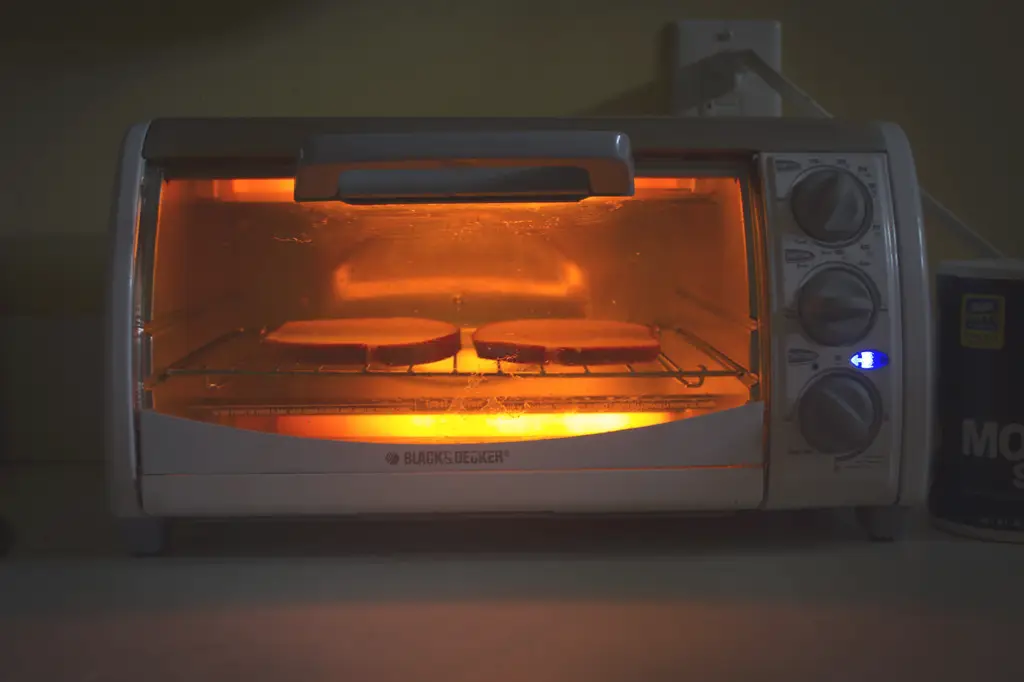 Toasting two slices of bread in a toaster oven.
